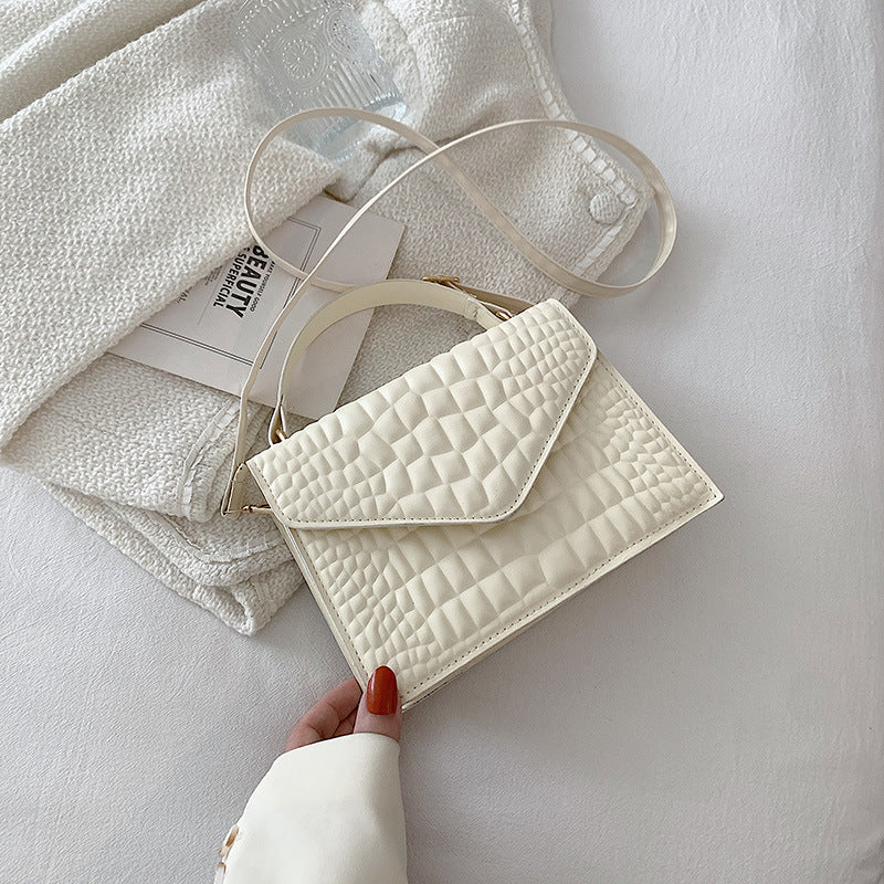 CLÉMENCE
 MINI SAC EN CUIR TEXTURÉ